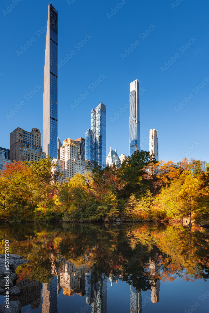 Fototapeta premium Midtown Manhattan view of Central Park in Fall with Billionaires' Row skyscrapers. New York City