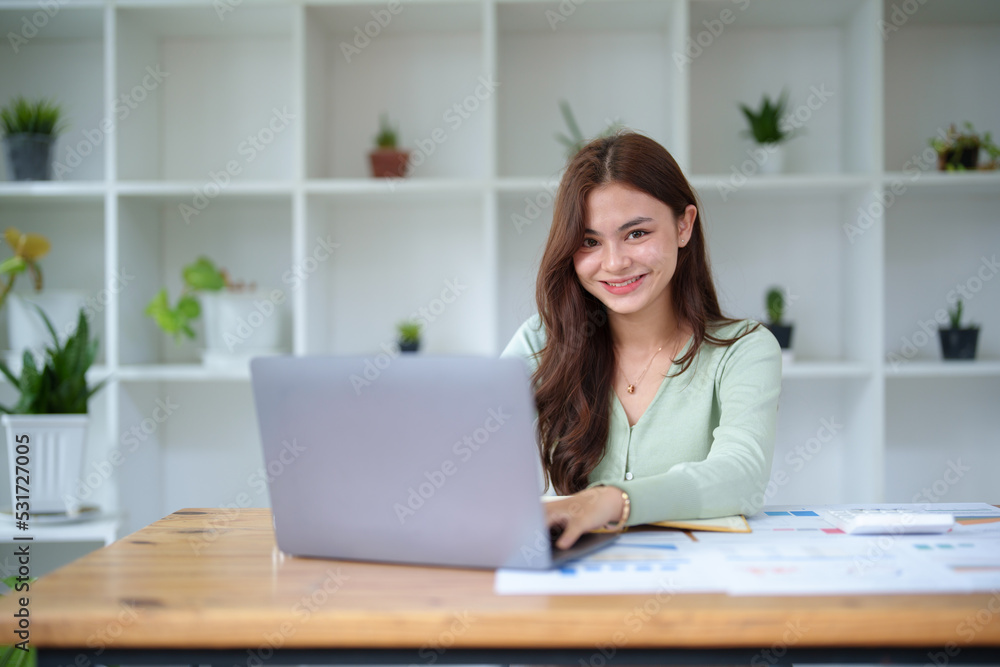 half girl using computers and documents to work at office half girl using computers and documents to work at office