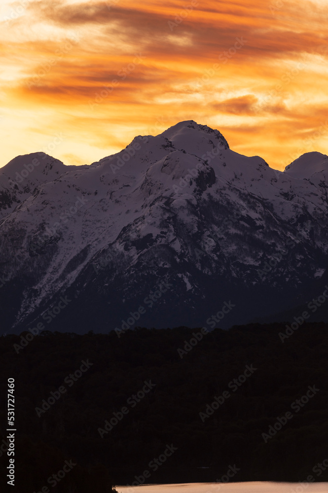 Sunset on the peaks of the Andes Mountains, Views from the San Carlos de Bariloche Circuit, Nahuel Huapi National Park. Patagonia, Argentina. Sunset on the peaks of the Andes Mountains, Views from the San Carlos de Bariloche Circuit, Nahuel Huapi National Park. Patagonia, Argentina.