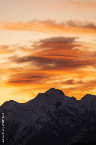 Sunset on the peaks of the Andes Mountains, Views from the San Carlos de Bariloche Circuit, Nahuel Huapi National Park. Patagonia, Argentina.