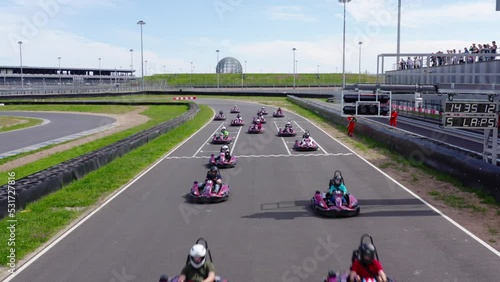 Start of kart race competition, aerial view. Crane shot photo