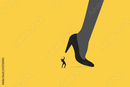 woman big shoes trying to stomping step on his small worker or businessman.