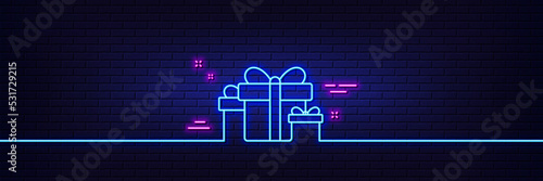 Neon light glow effect. Gift boxes line icon. Present or Sale sign. Birthday Shopping symbol. Package in Gift Wrap. 3d line neon glow icon. Brick wall banner. Holiday presents outline. Vector