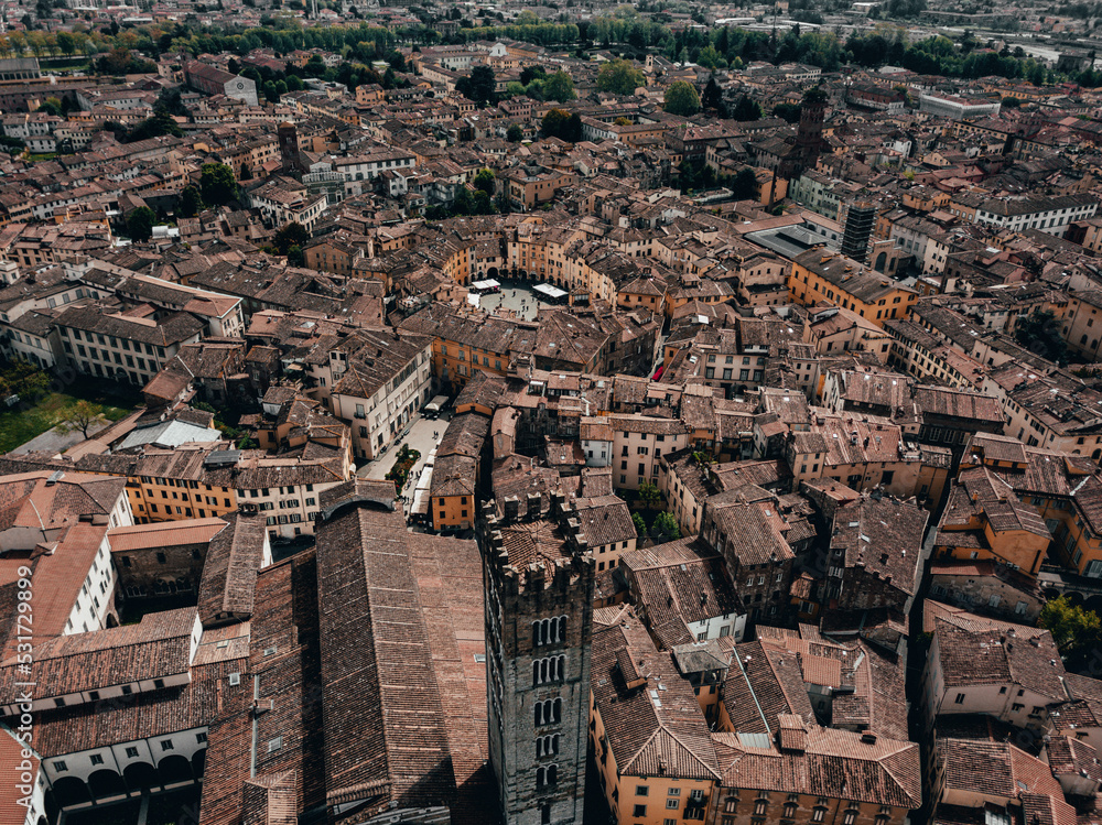 Landmarks of Tuscany in Italy - beautiful medieval town of Lucca in Tuscany. City view from abobe - Drone Image. Panoramic View. Church and and Old Town. Landmarks of Tuscany in Italy - beautiful medieval town of Lucca in Tuscany. City view from abobe - Drone Image. Panoramic View. Church and and Old Town.