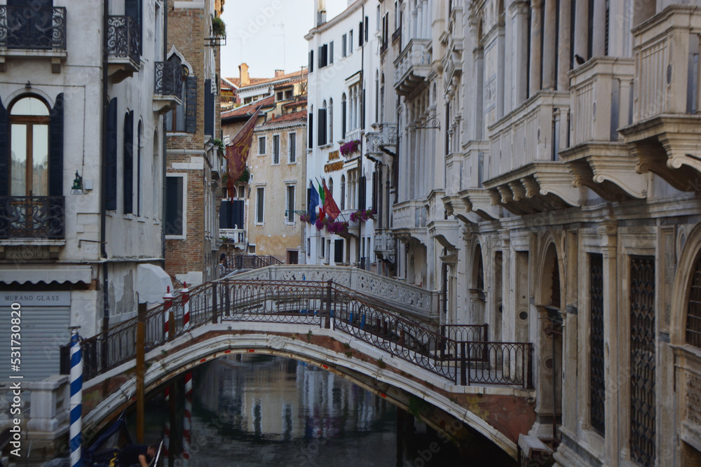 Scenic canal with gondola, Venice, Italy, in summer