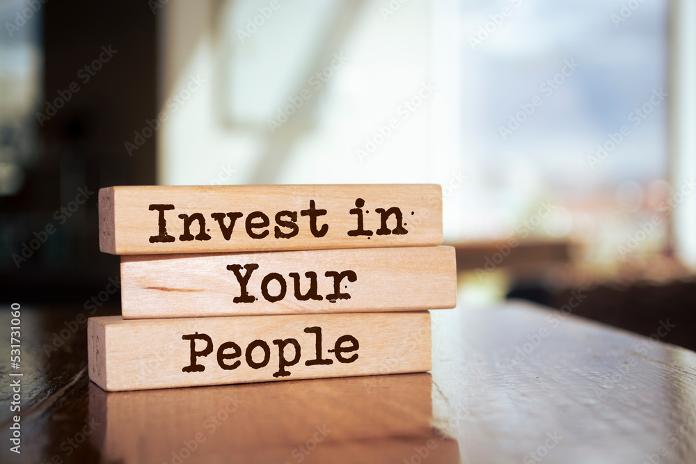 Wooden blocks with words 'Invest in Your People'. Wooden blocks with words 'Invest in Your People'.
