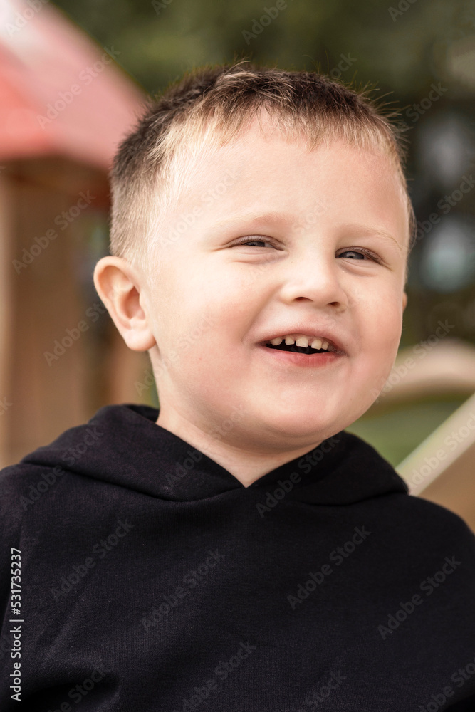 Boy Smiling Portrait. Happy Little Boy Laughing Has fun in Nature Park. Happy Children concept. Boy Smiling Portrait. Happy Little Boy Laughing Has fun in Nature Park. Happy Children concept.