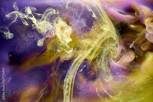 Multicolored yellow lilac smoke abstract background  acrylic paint underwater explosion