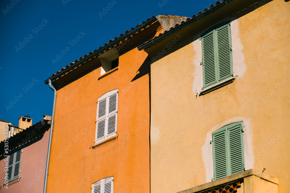 colourful buildings fro, the south of France with a blue sky in the background