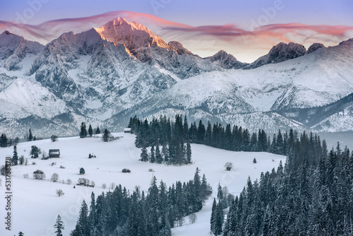 Tatra Mountains, winter, snow, frost. Panorama of the winter Tatra Mountains and peaks at sunset, Poland, Gliczarów Górny. Tatry, zima, śnieg, mróz. Panorama zimowych gór o zachodzie słońca, Polska. 