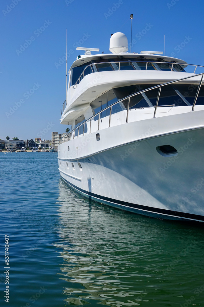 sideview of luxury yacht docked in the harbor sideview of luxury yacht docked in the harbor