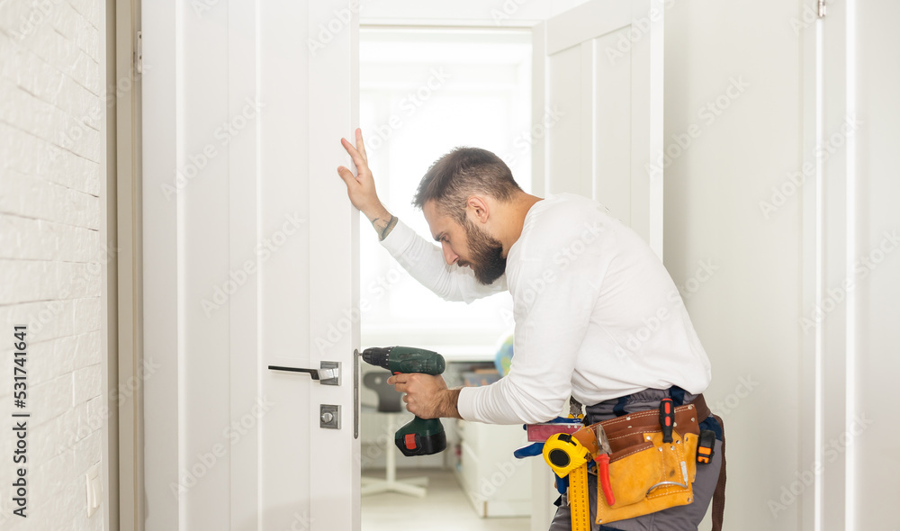 Portrait Young Male Carpenter Repairing Door Lock Portrait Young Male Carpenter Repairing Door Lock