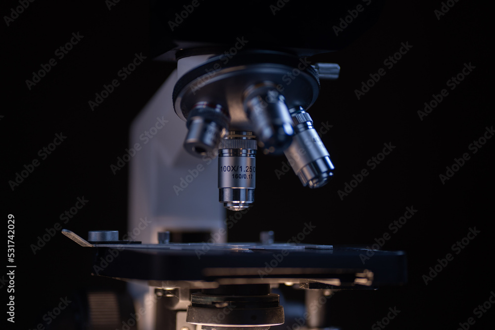 Close-up shot microscope lens at laboratory. Close-up shot microscope lens at laboratory.