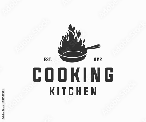 Skillet cast iron with fire logo design. Classic restaurant kitchen logo