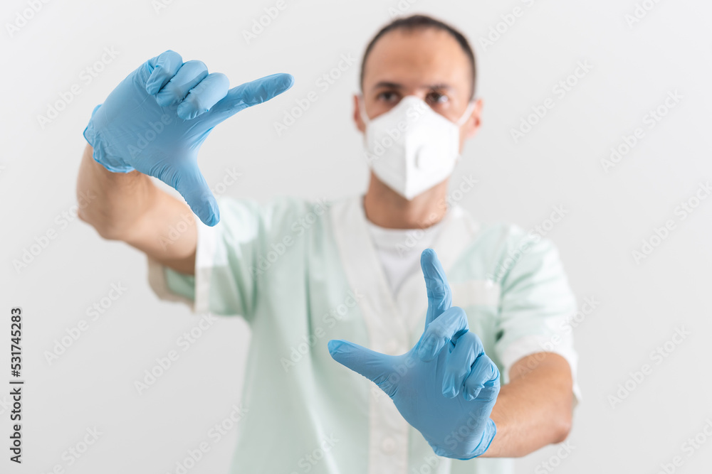 Man doctor medic in a protective respirator and face mask Man doctor medic in a protective respirator and face mask