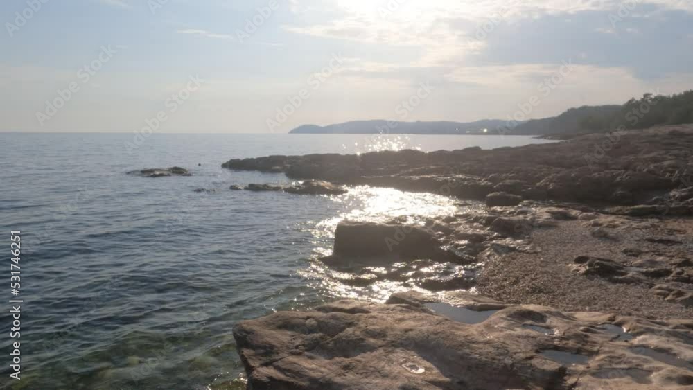 Beautiful summer travel scenery, view of rocks landscape. Rock beach shoreline seascape. Turquoise color of sea water. Summer holidays concept. Beautiful summer travel scenery, view of rocks landscape. Rock beach shoreline seascape. Turquoise color of sea water. Summer holidays concept.