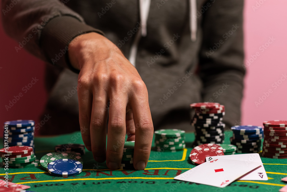 man playing blackjack at the table and betting chips man playing blackjack at the table and betting chips