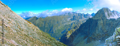 Mountain panorama. Mountain rocky landscape. Panoramic photo of mountain peaks and valleys. Majestic view of the rock peaks. High-resolution picture. Real photo of Tatra Mountains in Slovakia.