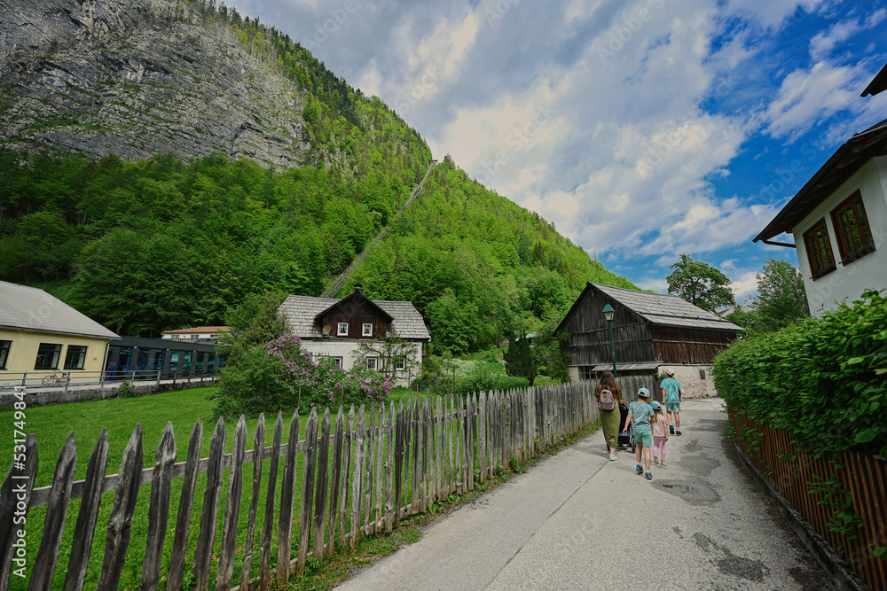 Mother walking with children at Hallstatt, Austria.