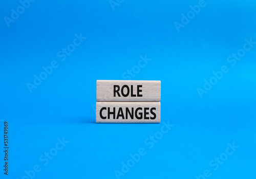 Role changes symbol. Concept words Role changes on wooden blocks. Beautiful blue background. Business and Role changes concept. Copy space.