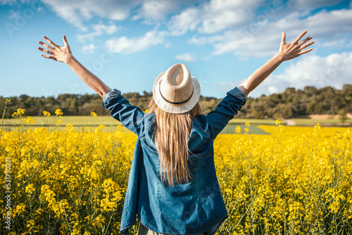 Shot of beautiful young woman enjoying spring in a field.