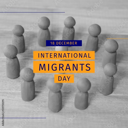 Composition of international migrants day text over black and white photo of pawns in circle