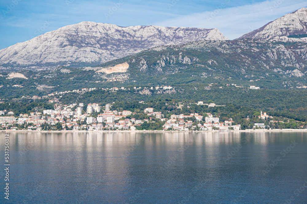 View of Bay of Kotor from the sea surrounded by mountains in Montenegro, one of the most beautiful bay in the world