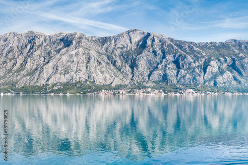 View of Bay of Kotor from the sea surrounded by mountains in Montenegro  one of the most beautiful bay in the world