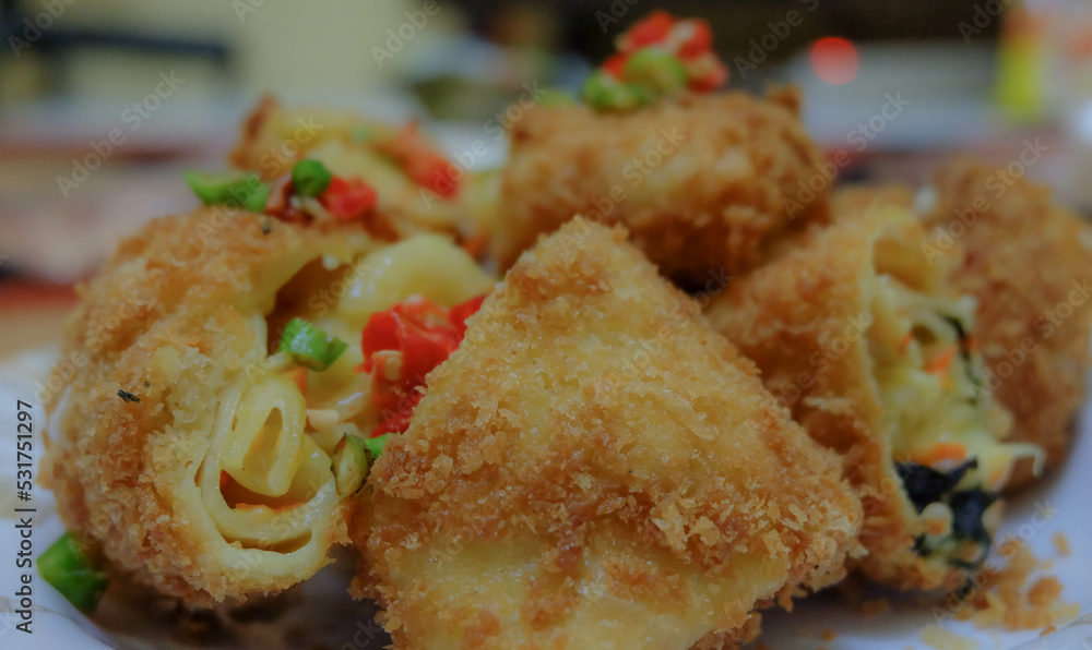 Risoles, a typical Indonesian heavy snack. Made from skin made from flour with a salty and savory vegetable ragout filling. Risoles, a typical Indonesian heavy snack. Made from skin made from flour with a salty and savory vegetable ragout filling.