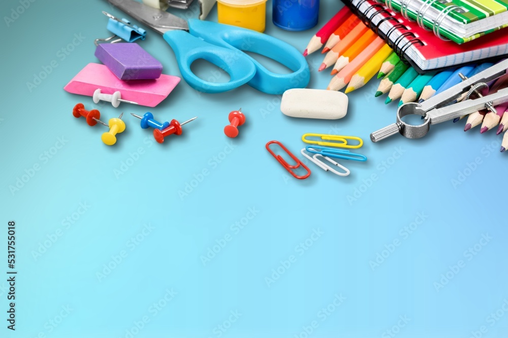 Set of school supplies in different colores on the desk