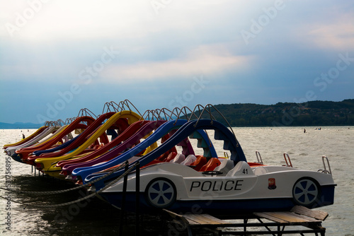 Parking water bikes in the beach of lake Balaton photo