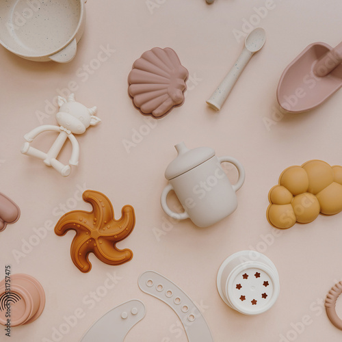 Set of different toys on pastel pink background. Flat lay, top view