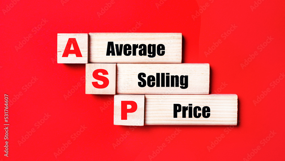 On a bright red background, wooden cubes and blocks with the text ASP Average Selling Price. Manufacturing of wooden toys. On a bright red background, wooden cubes and blocks with the text ASP Average Selling Price. Manufacturing of wooden toys.