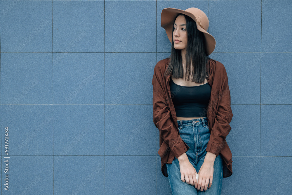 young woman on the street in autumn with hat