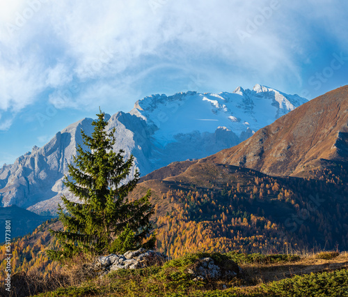 Autumn alpine Dolomites mountain scene, Sudtirol, Italy. View from Falzarego Pass to Marmolada massif and Glacier.