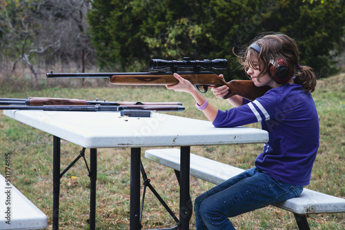 Child shooting a rifle