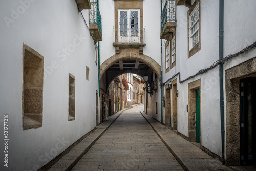 Fototapeta Naklejka Na Ścianę i Meble -  Arch House (Casa do Arco) at Medieval Santa Maria Street - Guimaraes, Portugal