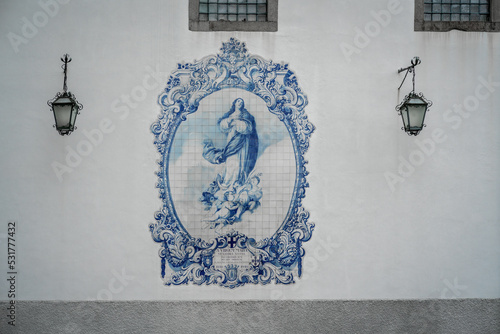 Virgin Mary in blue and white portuguese azulejo tiles on the wall of the former Church and Monastery of Carmo - Guimaraes, Portugal photo