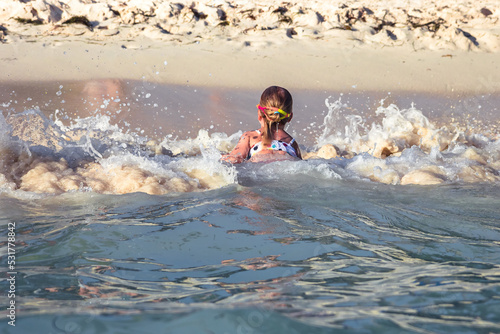 Child danger swimming alone in sea concept children water safety © splendens