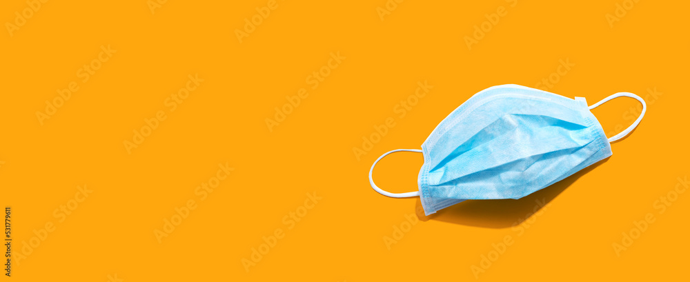 Blue surgical mask overhead view - flat lay Blue surgical mask overhead view - flat lay