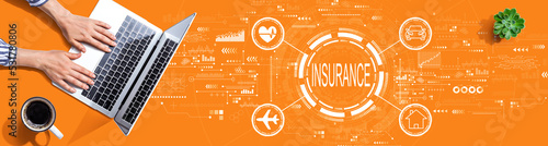 Insurance concept with person using a laptop computer
