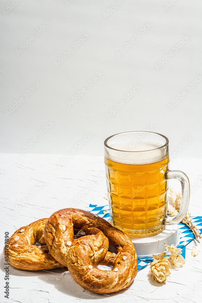 Traditional Oktoberfest set. Pretzels, beer, traditional pattern napkin. German festival food Traditional Oktoberfest set. Pretzels, beer, traditional pattern napkin. German festival food
