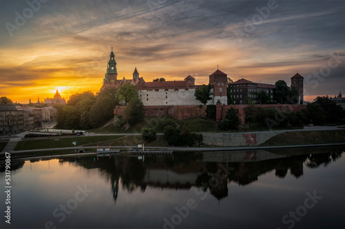 Wawel Royal Castle at dark dawn with water reflection, Krakow, Poland