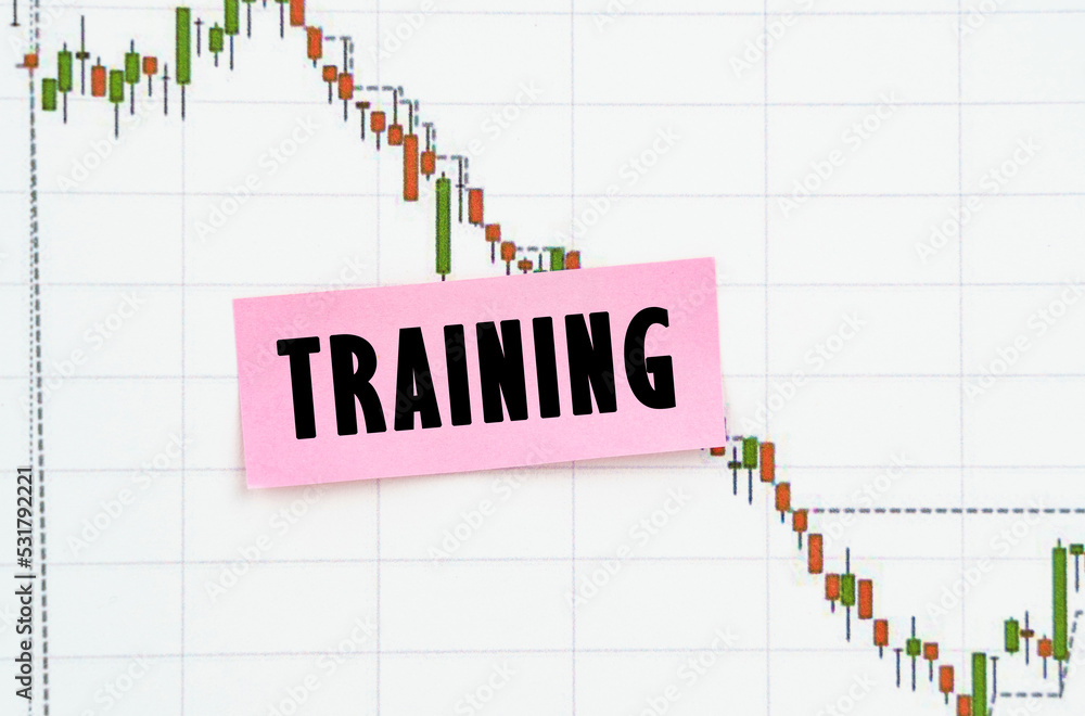 Against the background of the quote chart, a sticker with the inscription - TRAINING Against the background of the quote chart, a sticker with the inscription - TRAINING