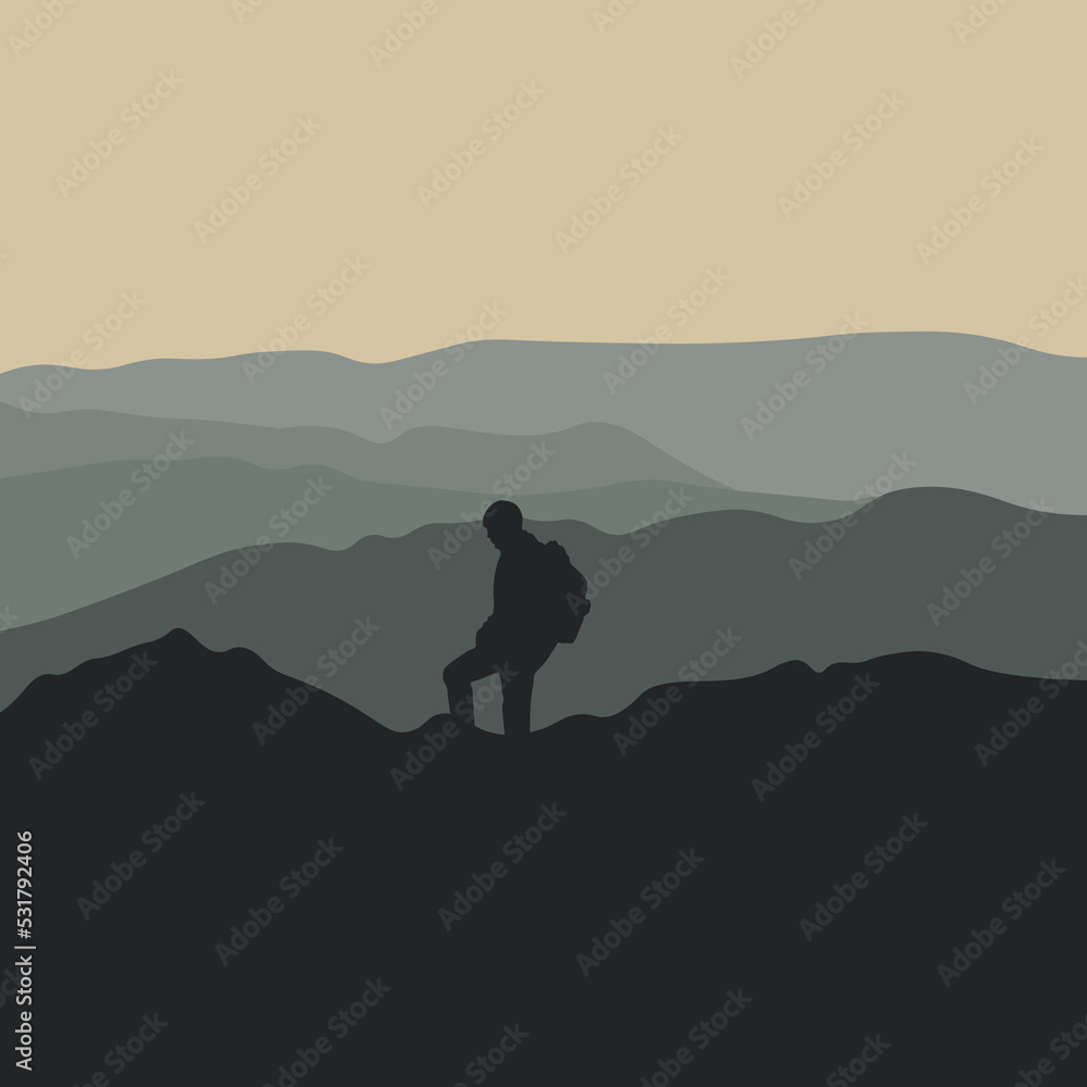 Silhouette of a hiker climbing on the mountain