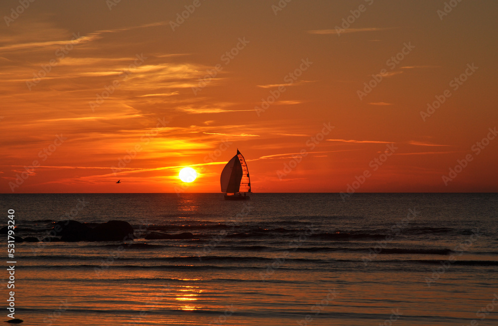silhouette of a boat on sunset