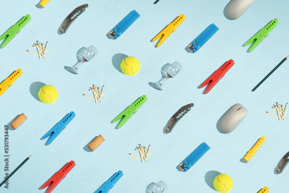 pattern of tenis ball mause cork pencil wine glass stirrup match lighter and wine opener.minimal crearive composition pattern of tenis ball mause cork pencil wine glass stirrup match lighter and wine opener.minimal crearive composition