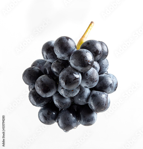 bunch of dark grapes on a white background