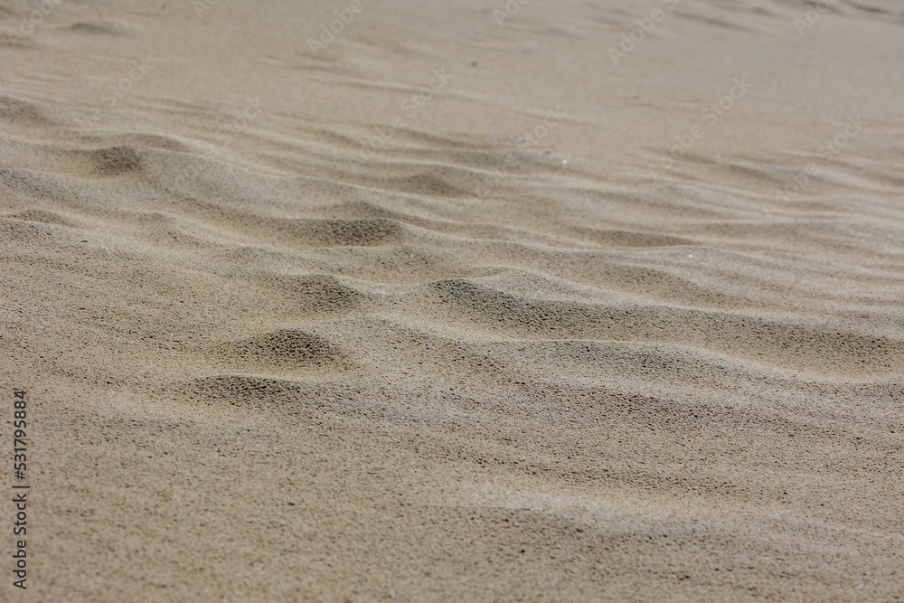 Selective focus of very fine sand beach in the summer under the sun, Beautiful structure on the sand texture, Nature pattern background. Selective focus of very fine sand beach in the summer under the sun, Beautiful structure on the sand texture, Nature pattern background.