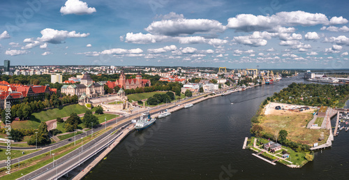 Summer wide panorama of Szczecin, Zachodniopomorskie, Poland. Aerial view on the Muzeum Narodowe, Politechnika morska and Urząd Wojewódzki on Wały Chrobrego hill at the Oder river, port in background